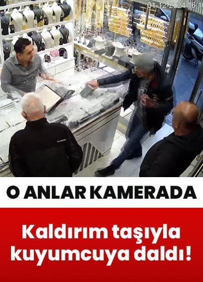 Kaldırım taşıyla kuyumcuya daldı! O anlar güvenlik kamerasında